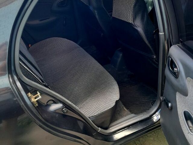 Черный Дэу Ланос, объемом двигателя 1.5 л и пробегом 370 тыс. км за 2300 $, фото 3 на Automoto.ua