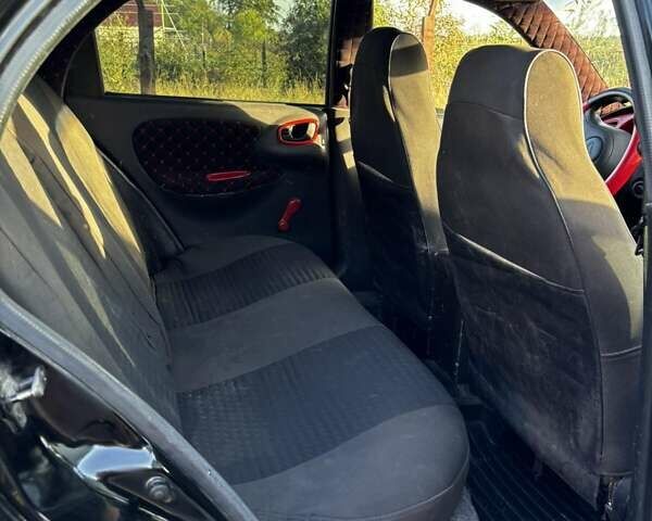 Черный Дэу Ланос, объемом двигателя 1.5 л и пробегом 328 тыс. км за 2300 $, фото 5 на Automoto.ua