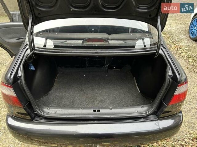 Чорний Деу Ланос, об'ємом двигуна 1.5 л та пробігом 222 тис. км за 1800 $, фото 19 на Automoto.ua