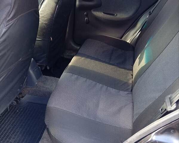 Деу Ланос 2006 у Буче на Automoto.ua Чорний Деу Ланос, об'ємом двигуна 1.5 л та пробігом 410 тис. км за 2250 $, фото 12 на Automoto.ua