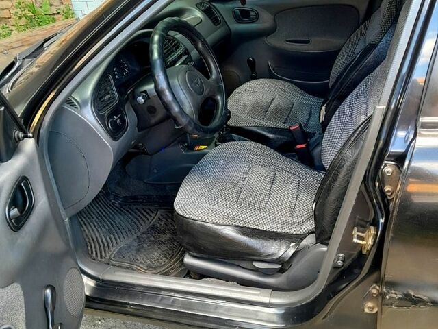 Черный Дэу Ланос, объемом двигателя 1.5 л и пробегом 370 тыс. км за 2300 $, фото 4 на Automoto.ua