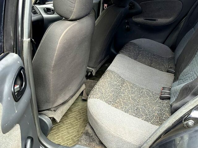 Черный Дэу Ланос, объемом двигателя 1.5 л и пробегом 250 тыс. км за 1400 $, фото 5 на Automoto.ua