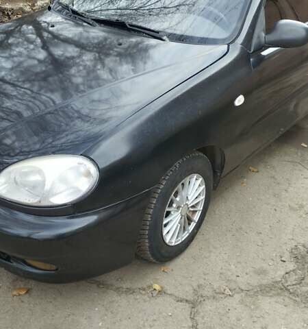 Черный Дэу Ланос, объемом двигателя 1.5 л и пробегом 244 тыс. км за 1650 $, фото 2 на Automoto.ua