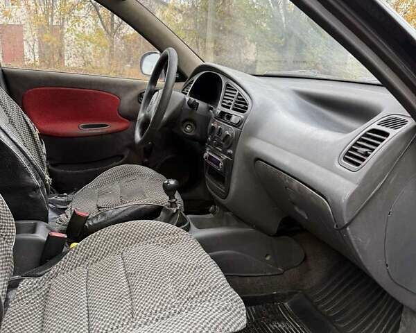 Черный Дэу Ланос, объемом двигателя 1.5 л и пробегом 100 тыс. км за 900 $, фото 10 на Automoto.ua