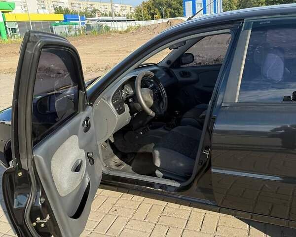 Черный Дэу Ланос, объемом двигателя 1.5 л и пробегом 163 тыс. км за 2900 $, фото 15 на Automoto.ua