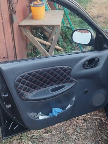 Черный Дэу Ланос, объемом двигателя 1.5 л и пробегом 147 тыс. км за 1800 $, фото 4 на Automoto.ua