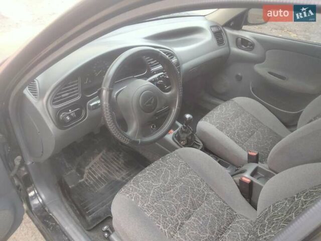 Черный Дэу Ланос, объемом двигателя 1.5 л и пробегом 200 тыс. км за 1550 $, фото 7 на Automoto.ua