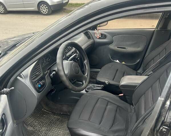 Черный Дэу Ланос, объемом двигателя 1.5 л и пробегом 225 тыс. км за 1200 $, фото 6 на Automoto.ua