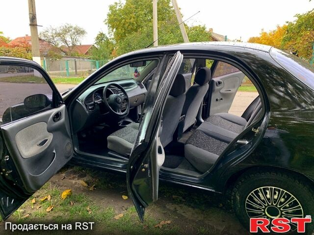 Черный Дэу Ланос, объемом двигателя 1.5 л и пробегом 256 тыс. км за 2600 $, фото 9 на Automoto.ua