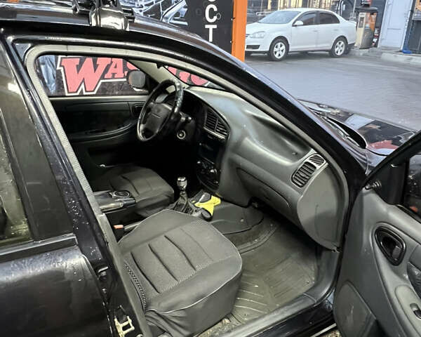 Черный Дэу Ланос, объемом двигателя 1.5 л и пробегом 145 тыс. км за 1799 $, фото 14 на Automoto.ua