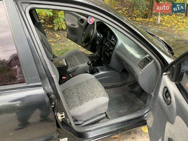Черный Дэу Ланос, объемом двигателя 1.5 л и пробегом 263 тыс. км за 1830 $, фото 6 на Automoto.ua