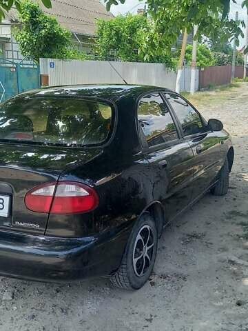 Черный Дэу Ланос, объемом двигателя 1.5 л и пробегом 328 тыс. км за 2700 $, фото 2 на Automoto.ua