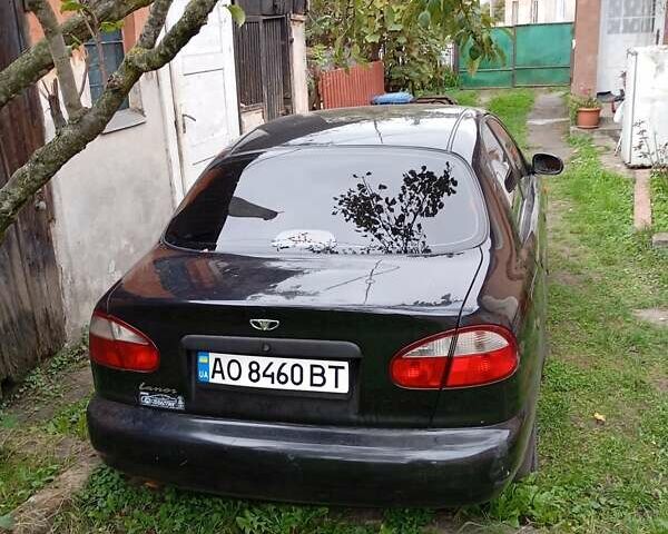 Черный Дэу Ланос, объемом двигателя 1.5 л и пробегом 272 тыс. км за 2000 $, фото 1 на Automoto.ua