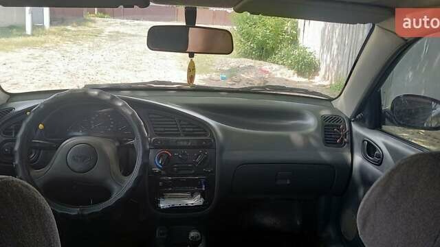 Черный Дэу Ланос, объемом двигателя 1.5 л и пробегом 328 тыс. км за 2700 $, фото 1 на Automoto.ua