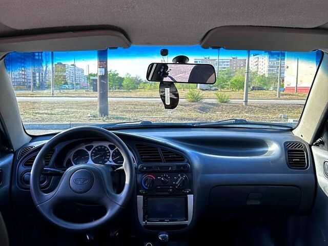 Черный Дэу Ланос, объемом двигателя 1.5 л и пробегом 310 тыс. км за 2500 $, фото 1 на Automoto.ua