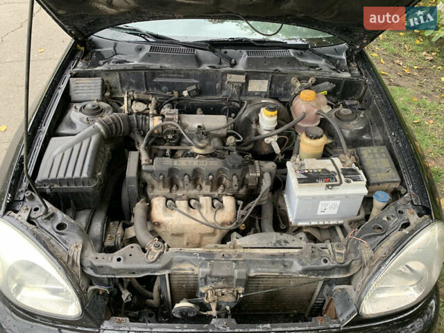 Черный Дэу Ланос, объемом двигателя 1.5 л и пробегом 263 тыс. км за 1830 $, фото 10 на Automoto.ua