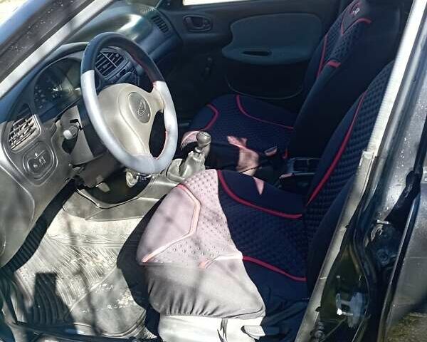 Черный Дэу Ланос, объемом двигателя 1.5 л и пробегом 250 тыс. км за 1750 $, фото 7 на Automoto.ua