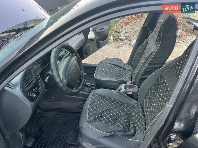 Черный Дэу Ланос, объемом двигателя 1.5 л и пробегом 160 тыс. км за 2800 $, фото 10 на Automoto.ua