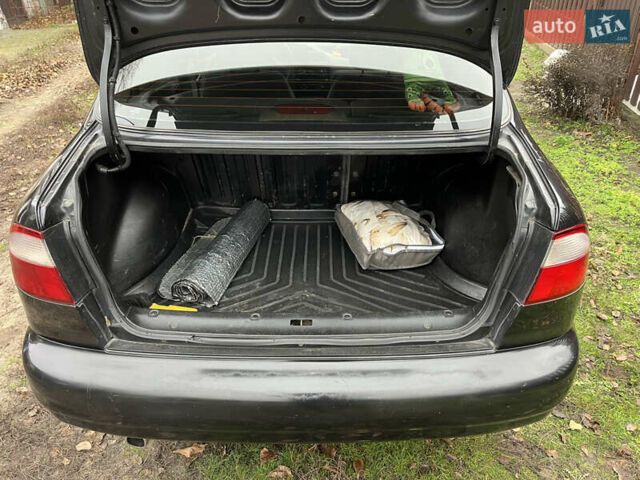 Черный Дэу Ланос, объемом двигателя 1.5 л и пробегом 140 тыс. км за 2500 $, фото 11 на Automoto.ua