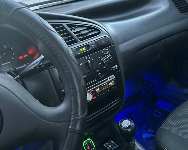 Черный Дэу Ланос, объемом двигателя 1.5 л и пробегом 270 тыс. км за 1900 $, фото 11 на Automoto.ua