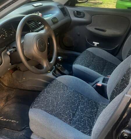 Черный Дэу Ланос, объемом двигателя 1.5 л и пробегом 110 тыс. км за 1500 $, фото 2 на Automoto.ua