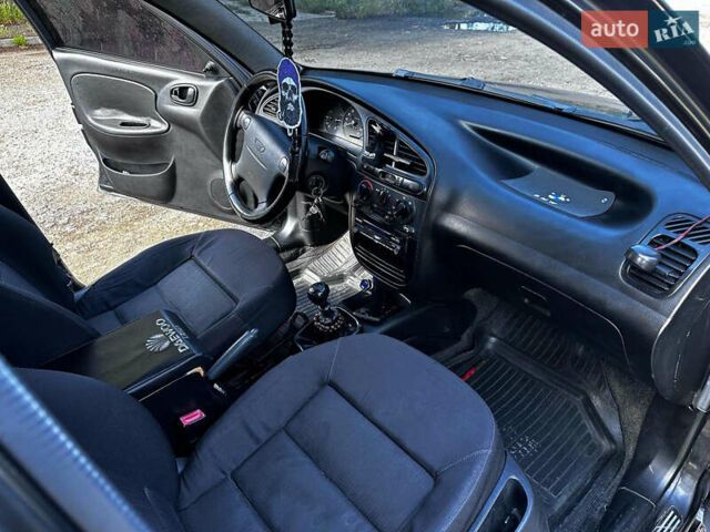 Черный Дэу Ланос, объемом двигателя 1.5 л и пробегом 220 тыс. км за 3100 $, фото 9 на Automoto.ua