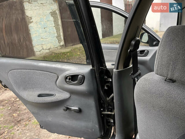 Черный Дэу Ланос, объемом двигателя 1.5 л и пробегом 140 тыс. км за 2500 $, фото 24 на Automoto.ua