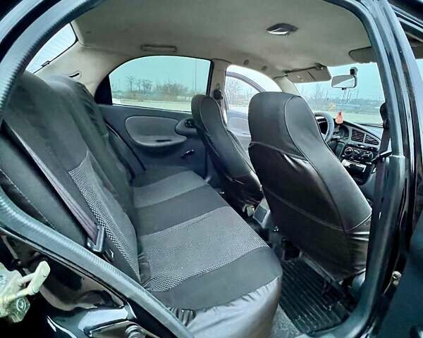 Черный Дэу Ланос, объемом двигателя 1.5 л и пробегом 653 тыс. км за 2199 $, фото 12 на Automoto.ua