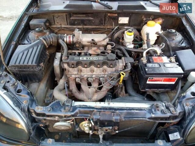 Черный Дэу Ланос, объемом двигателя 1.5 л и пробегом 231 тыс. км за 1999 $, фото 14 на Automoto.ua