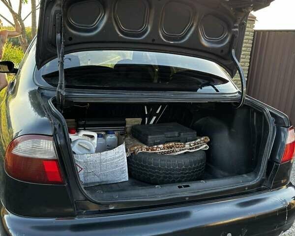 Деу Ланос 2006 у Новомосковске на Automoto.ua Чорний Деу Ланос, об'ємом двигуна 1.5 л та пробігом 328 тис. км за 1800 $, фото 12 на Automoto.ua