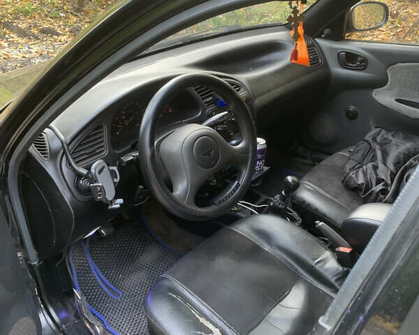 Черный Дэу Ланос, объемом двигателя 1.5 л и пробегом 290 тыс. км за 1600 $, фото 5 на Automoto.ua