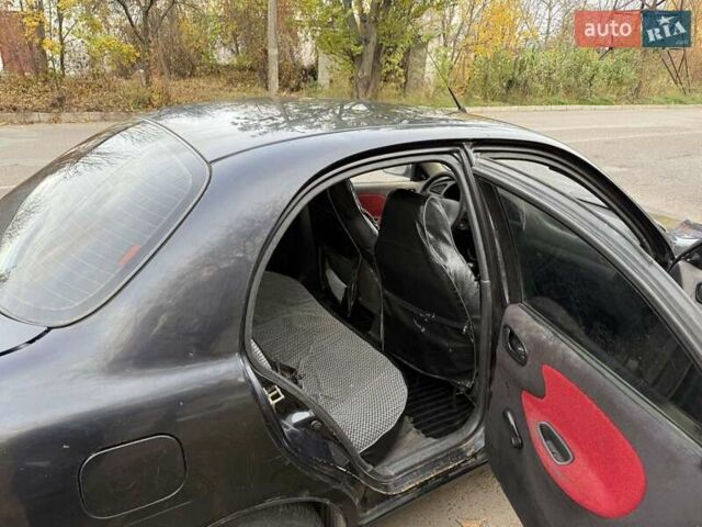 Черный Дэу Ланос, объемом двигателя 1.5 л и пробегом 100 тыс. км за 900 $, фото 14 на Automoto.ua