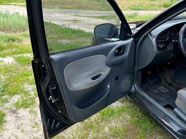 Черный Дэу Ланос, объемом двигателя 1.5 л и пробегом 250 тыс. км за 1400 $, фото 7 на Automoto.ua