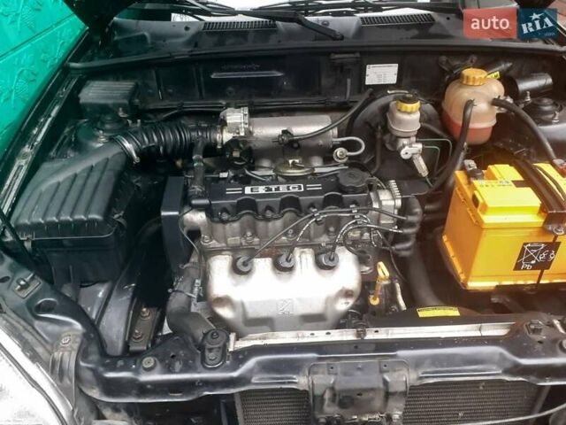 Черный Дэу Ланос, объемом двигателя 1.5 л и пробегом 94 тыс. км за 2800 $, фото 2 на Automoto.ua