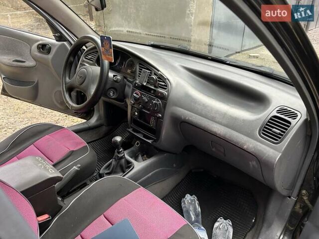 Чорний Деу Ланос, об'ємом двигуна 1.5 л та пробігом 222 тис. км за 1800 $, фото 22 на Automoto.ua