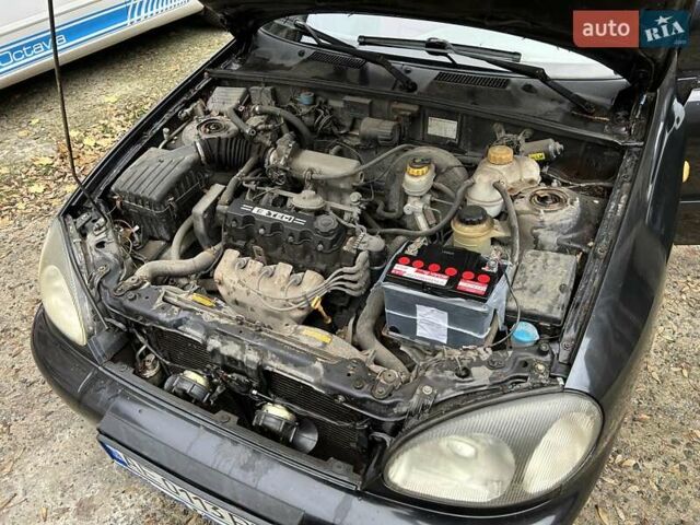 Чорний Деу Ланос, об'ємом двигуна 1.5 л та пробігом 222 тис. км за 1800 $, фото 20 на Automoto.ua