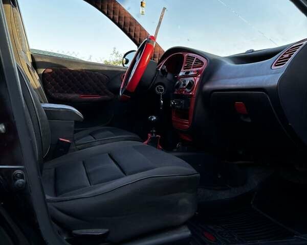 Черный Дэу Ланос, объемом двигателя 1.5 л и пробегом 328 тыс. км за 2300 $, фото 4 на Automoto.ua