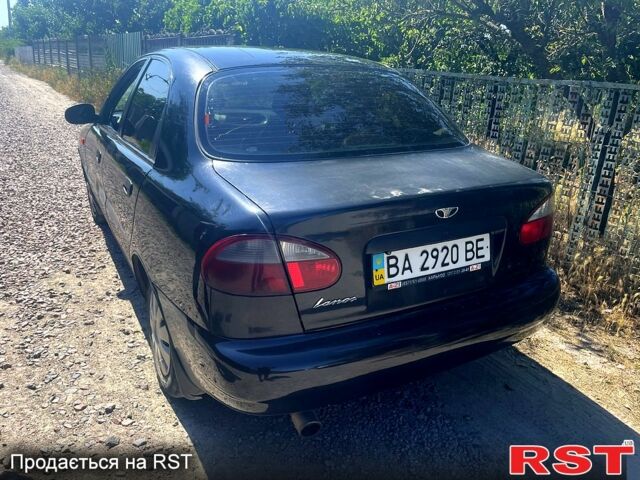 Черный Дэу Ланос, объемом двигателя 1.5 л и пробегом 200 тыс. км за 2000 $, фото 3 на Automoto.ua