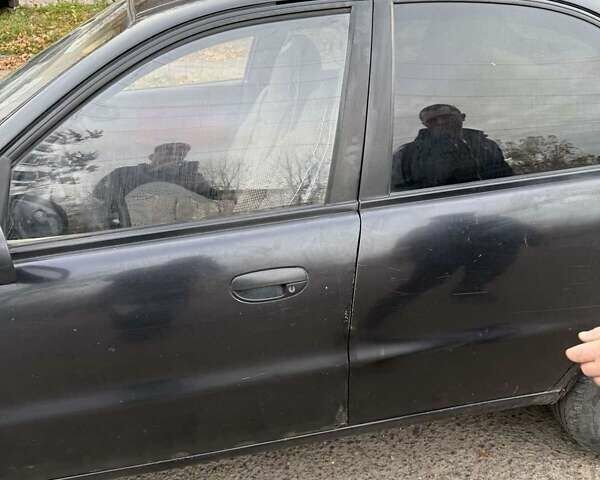 Черный Дэу Ланос, объемом двигателя 1.5 л и пробегом 100 тыс. км за 900 $, фото 21 на Automoto.ua