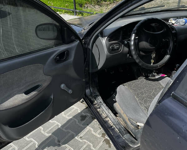 Черный Дэу Ланос, объемом двигателя 1.5 л и пробегом 100 тыс. км за 1400 $, фото 5 на Automoto.ua