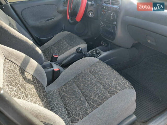 Черный Дэу Ланос, объемом двигателя 1.5 л и пробегом 226 тыс. км за 1450 $, фото 8 на Automoto.ua