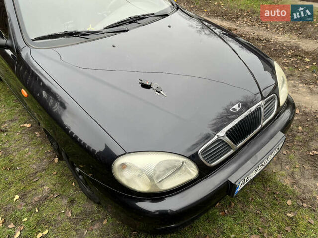 Черный Дэу Ланос, объемом двигателя 1.5 л и пробегом 140 тыс. км за 2500 $, фото 1 на Automoto.ua