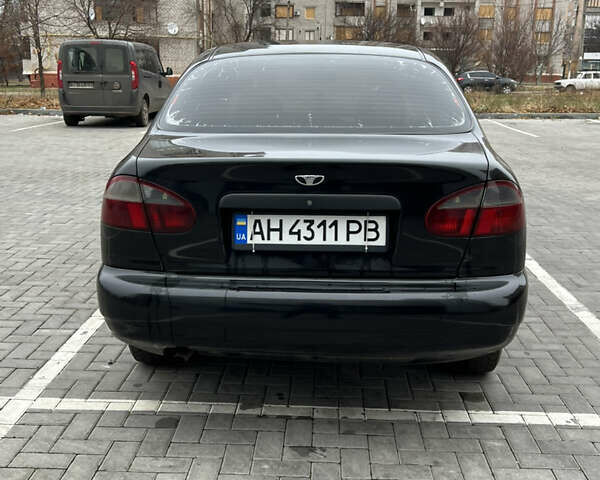 Черный Дэу Ланос, объемом двигателя 1.5 л и пробегом 286 тыс. км за 2400 $, фото 4 на Automoto.ua