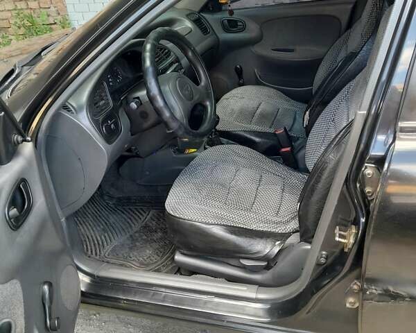 Чорний Деу Ланос, об'ємом двигуна 1.5 л та пробігом 371 тис. км за 2100 $, фото 1 на Automoto.ua