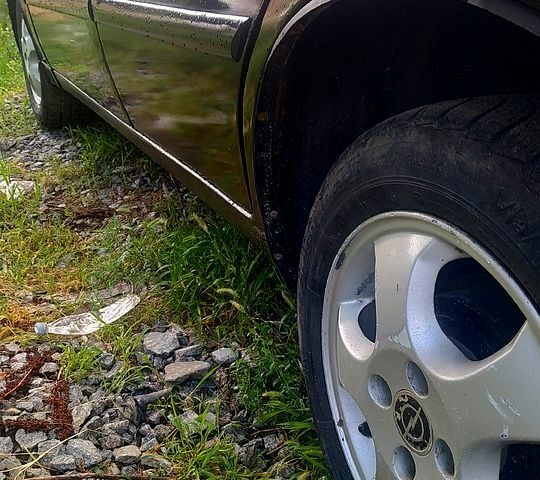 Черный Дэу Ланос, объемом двигателя 1.5 л и пробегом 230 тыс. км за 1000 $, фото 3 на Automoto.ua