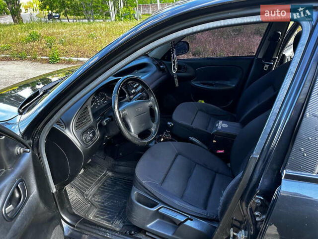 Черный Дэу Ланос, объемом двигателя 1.5 л и пробегом 220 тыс. км за 3100 $, фото 14 на Automoto.ua