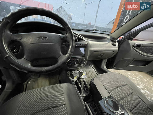 Черный Дэу Ланос, объемом двигателя 1.5 л и пробегом 145 тыс. км за 1799 $, фото 5 на Automoto.ua