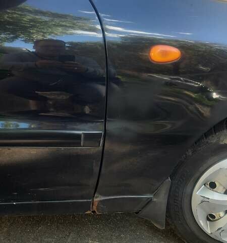 Черный Дэу Ланос, объемом двигателя 1.5 л и пробегом 110 тыс. км за 1500 $, фото 5 на Automoto.ua