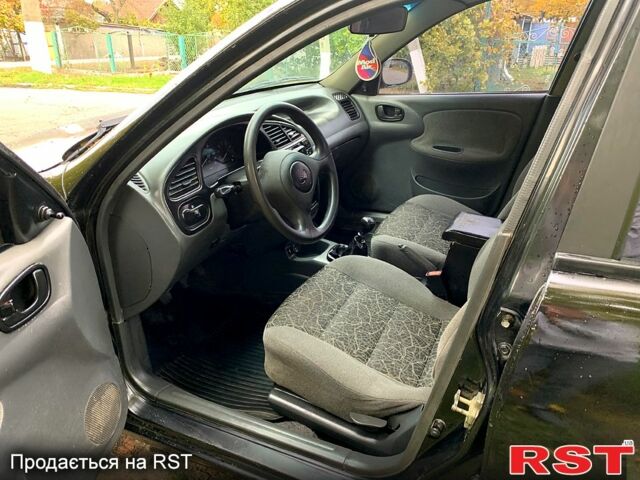 Черный Дэу Ланос, объемом двигателя 1.5 л и пробегом 256 тыс. км за 2600 $, фото 6 на Automoto.ua