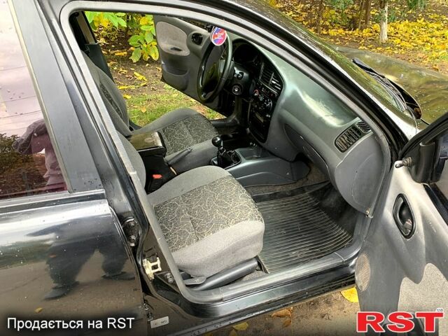 Черный Дэу Ланос, объемом двигателя 1.5 л и пробегом 256 тыс. км за 2600 $, фото 7 на Automoto.ua